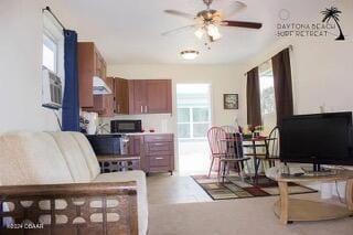 living area with ceiling fan