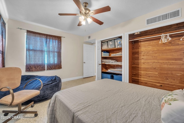 bedroom with baseboards, visible vents, and ceiling fan