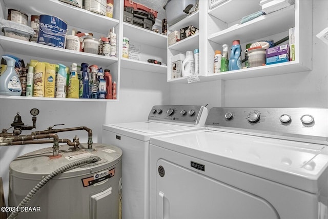 clothes washing area with washing machine and clothes dryer and electric water heater