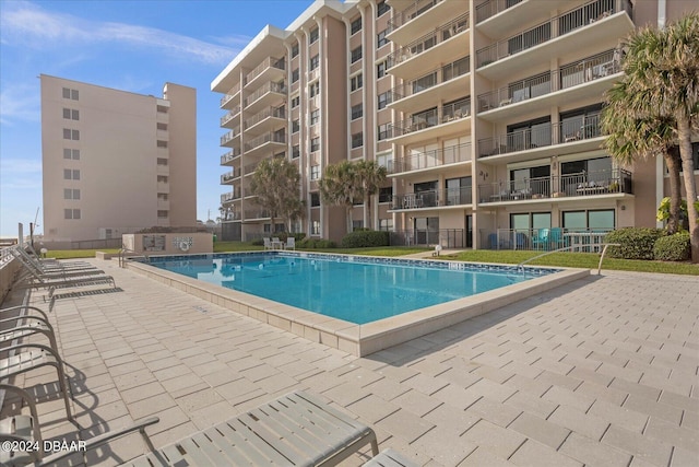 view of pool featuring a patio