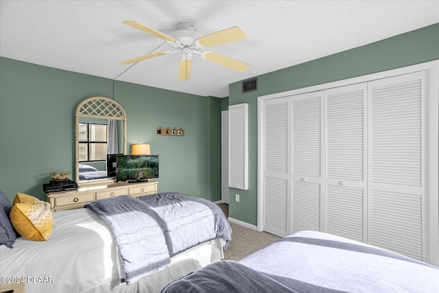 4445 S Atlantic Ave Unit 606, Ponce Inlet, FL 32127 - bedroom with light colored carpet, a closet, a ceiling fan, and baseboards