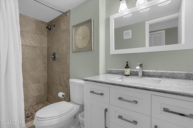 4445 S Atlantic Ave Unit 606, Ponce Inlet, FL 32127 - full bathroom with vanity, toilet, and a tile shower