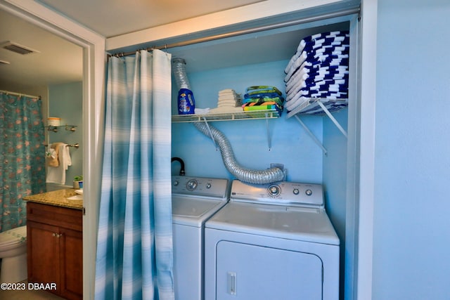 laundry room featuring washer and clothes dryer