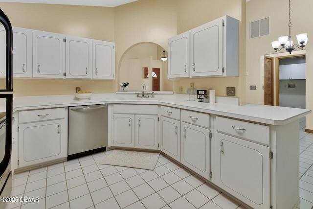 kitchen featuring a peninsula, stainless steel dishwasher, a sink, visible vents, and an inviting chandelier