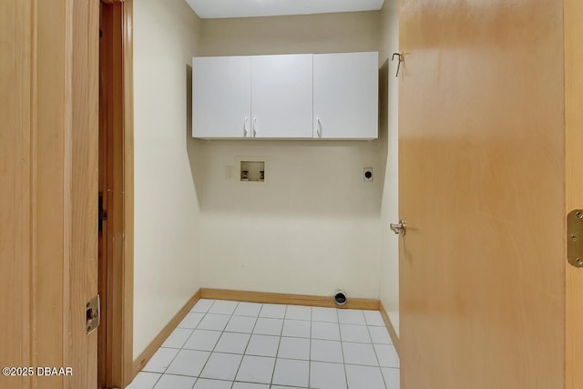 laundry area with light tile patterned floors, hookup for an electric dryer, hookup for a washing machine, baseboards, and cabinet space
