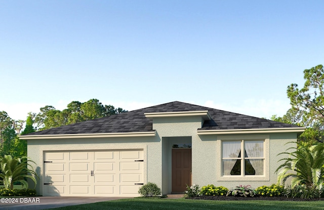 view of front of house featuring a garage and a front lawn