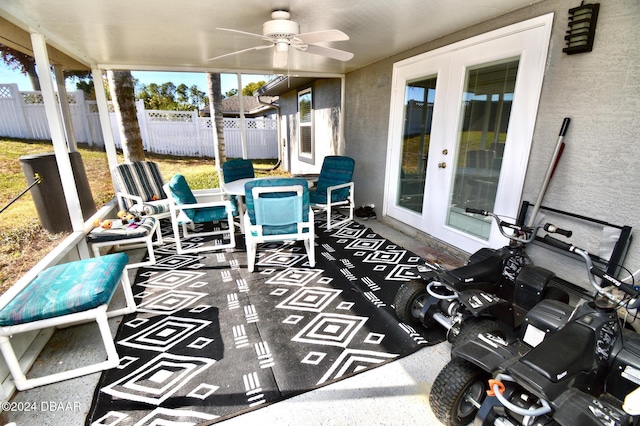 sunroom with french doors and ceiling fan