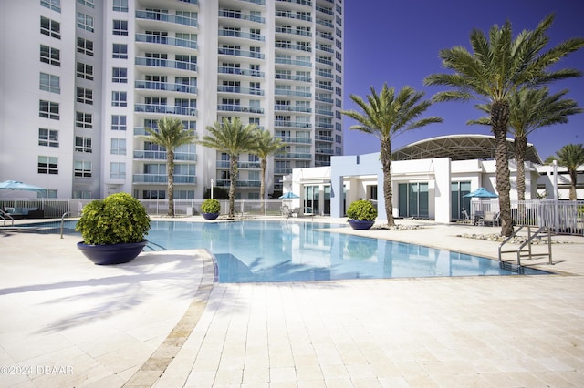 231 Riverside Dr Unit 1803-1, Daytona Beach, FL 32117 - community pool with fence and a patio area