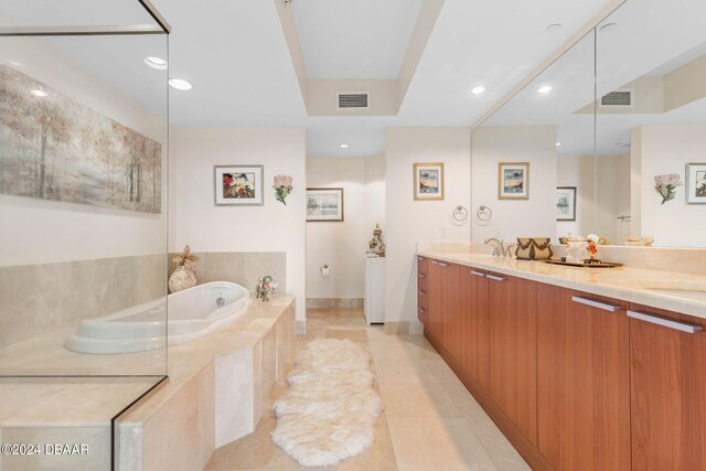 231 Riverside Dr Unit 1803-1, Daytona Beach, FL 32117 - bathroom featuring a garden tub, double vanity, recessed lighting, and tile patterned floors