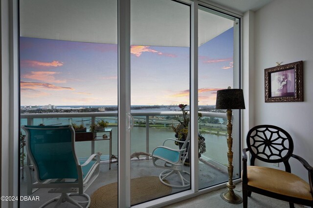 231 Riverside Dr Unit 1803-1, Daytona Beach, FL 32117 - balcony at dusk featuring a water view
