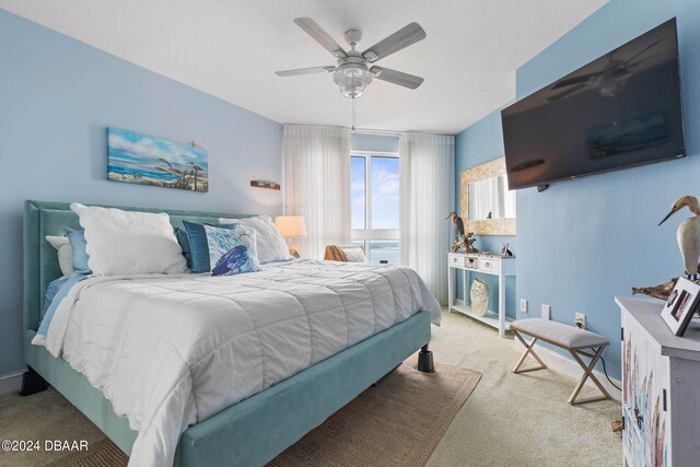 231 Riverside Dr Unit 1803-1, Daytona Beach, FL 32117 - bedroom with light colored carpet and ceiling fan