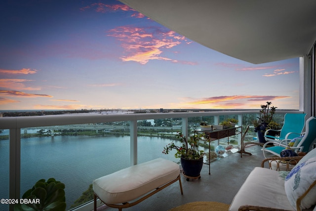 231 Riverside Dr Unit 1803-1, Daytona Beach, FL 32117 - balcony at dusk featuring a water view