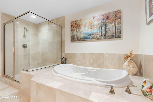 231 Riverside Dr Unit 1803-1, Daytona Beach, FL 32117 - bathroom featuring a shower stall and a garden tub