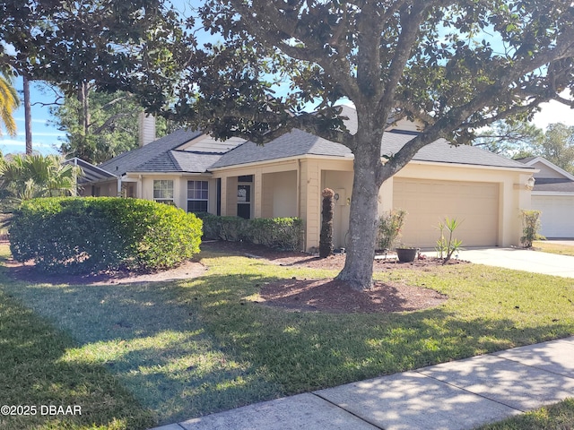 view of front facade featuring a garage and a front lawn