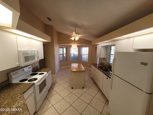 kitchen with visible vents, white cabinetry, vaulted ceiling, a textured ceiling, and white appliances