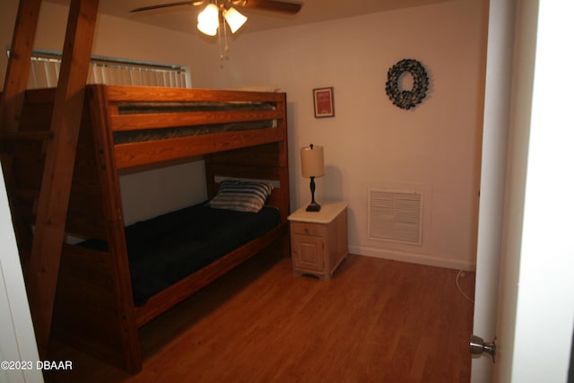 bedroom with hardwood / wood-style floors and ceiling fan