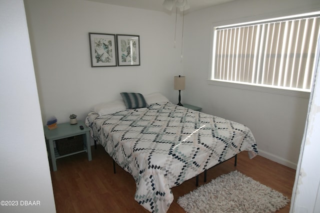 bedroom featuring wood-type flooring and ceiling fan