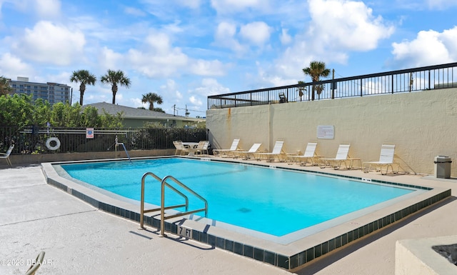 view of swimming pool featuring a patio area