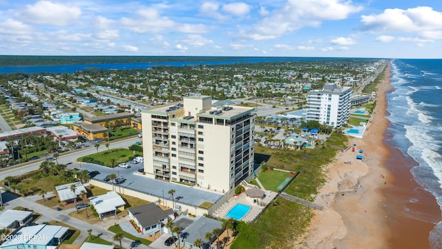 bird's eye view featuring a water view and a beach view