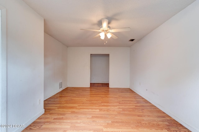 unfurnished room with ceiling fan and light hardwood / wood-style flooring