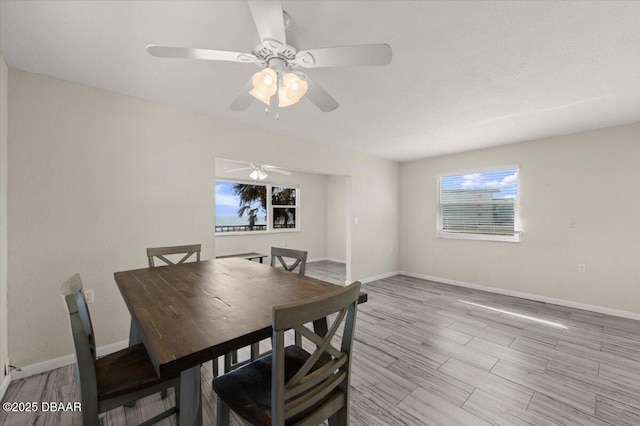 dining space with light wood-type flooring