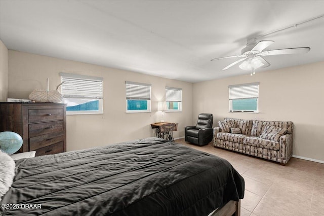 tiled bedroom with ceiling fan