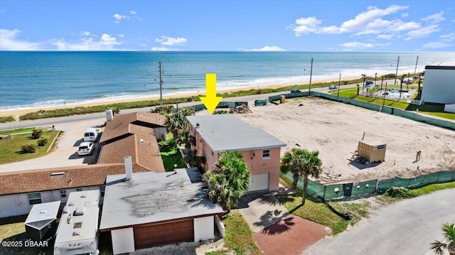 birds eye view of property featuring a water view and a view of the beach