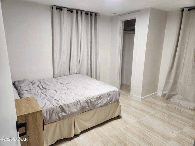 406 S Delaware Ave, Deland, FL 32720 - bedroom with baseboards and a closet