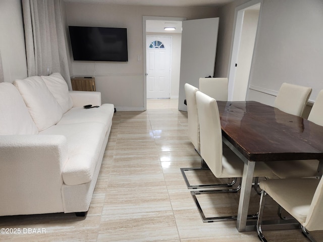 406 S Delaware Ave, Deland, FL 32720 - living area featuring baseboards and light tile patterned flooring