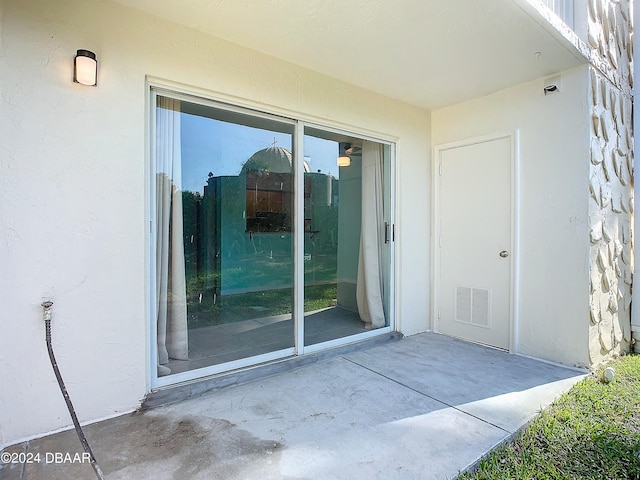 doorway to property featuring a patio