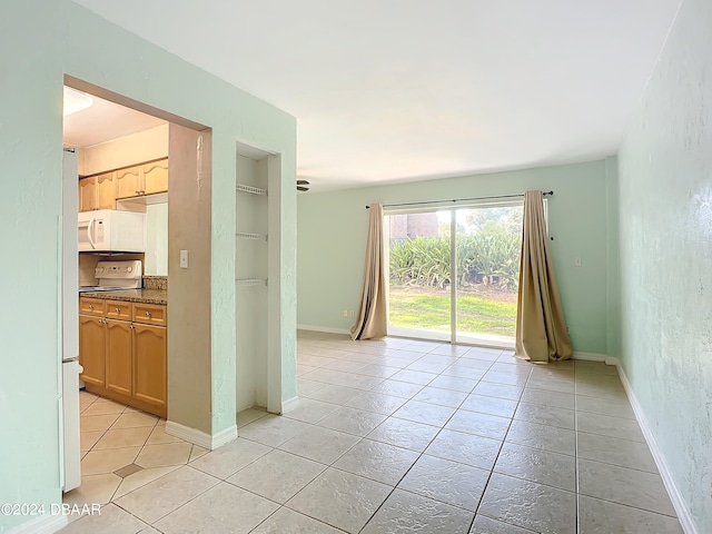 empty room with light tile patterned flooring