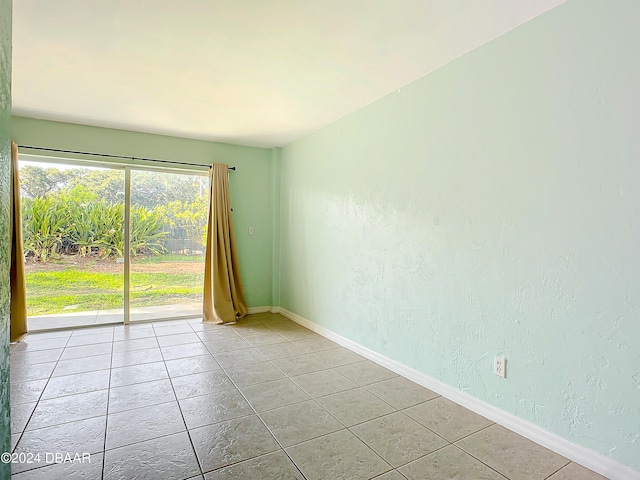 view of tiled spare room