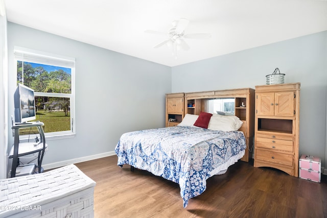 bedroom with hardwood / wood-style floors and ceiling fan