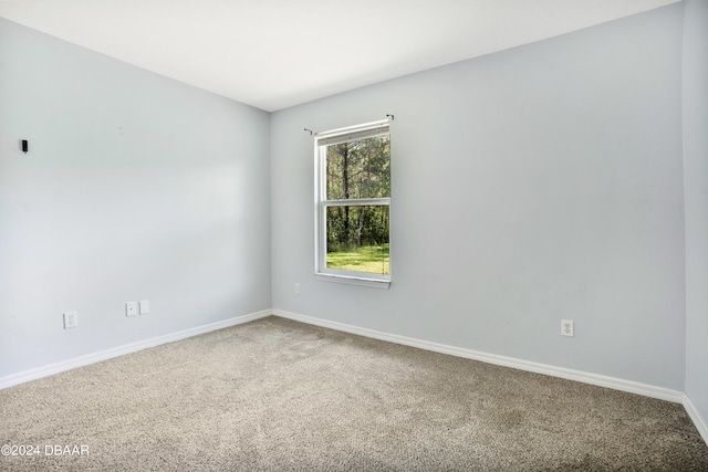 empty room with carpet flooring