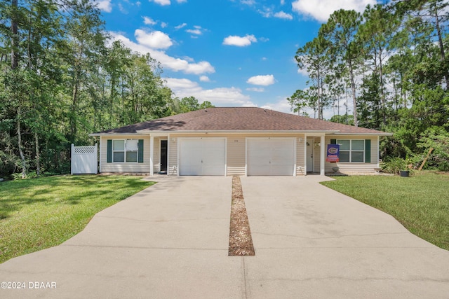 ranch-style house with a garage and a front lawn