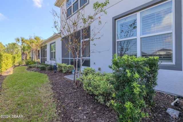 view of property exterior featuring a sunroom