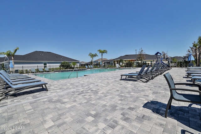 view of swimming pool featuring a patio area