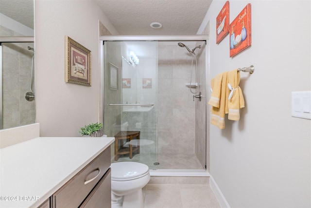 bathroom with toilet, a textured ceiling, and a shower with door