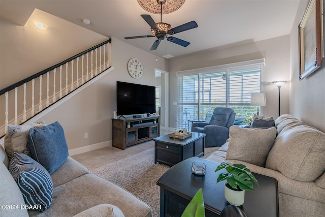 tiled living room featuring ceiling fan