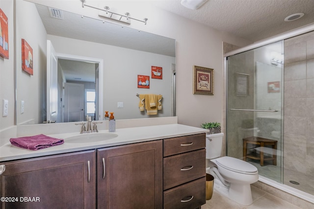 bathroom with toilet, an enclosed shower, a textured ceiling, and tile patterned flooring