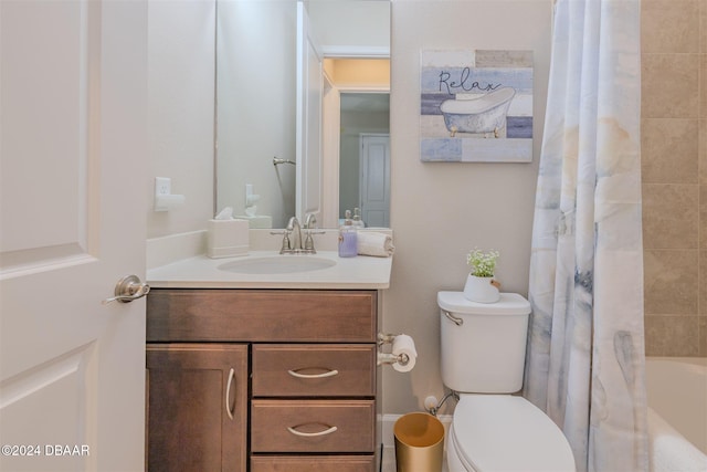 full bathroom with vanity, toilet, and shower / tub combo with curtain