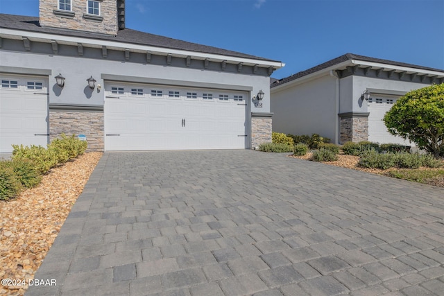 view of front of property with a garage