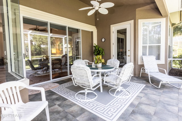 view of patio featuring ceiling fan