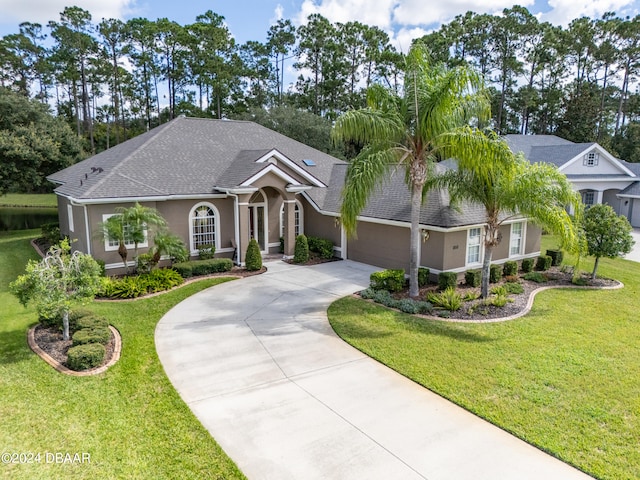 view of front facade with a garage and a front yard