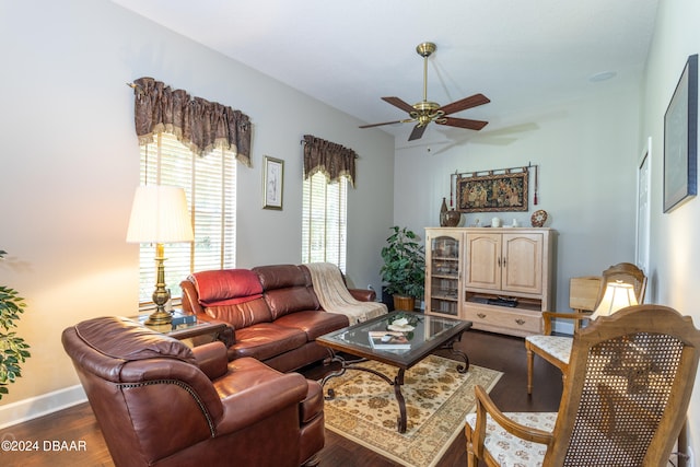 living room featuring dark hardwood / wood-style flooring and ceiling fan