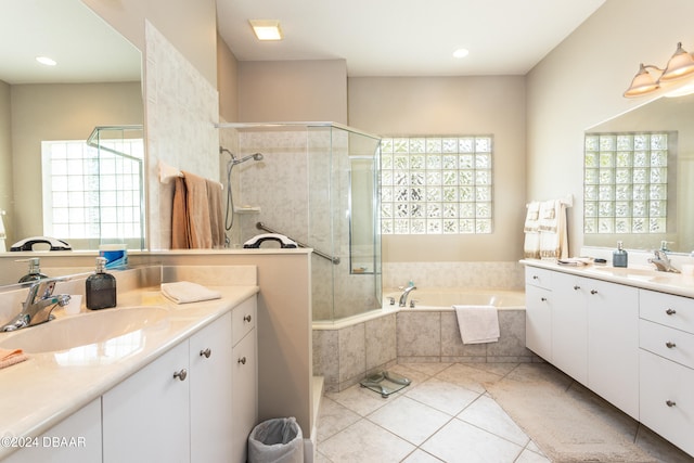 bathroom with vanity, plus walk in shower, and tile patterned flooring