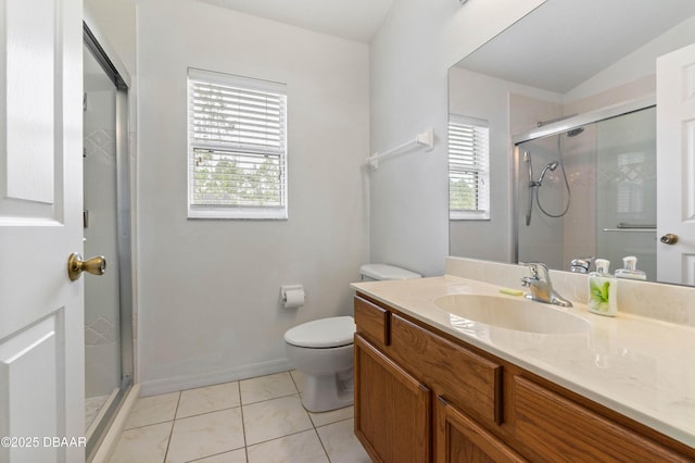 bathroom with walk in shower, a wealth of natural light, tile patterned floors, and toilet