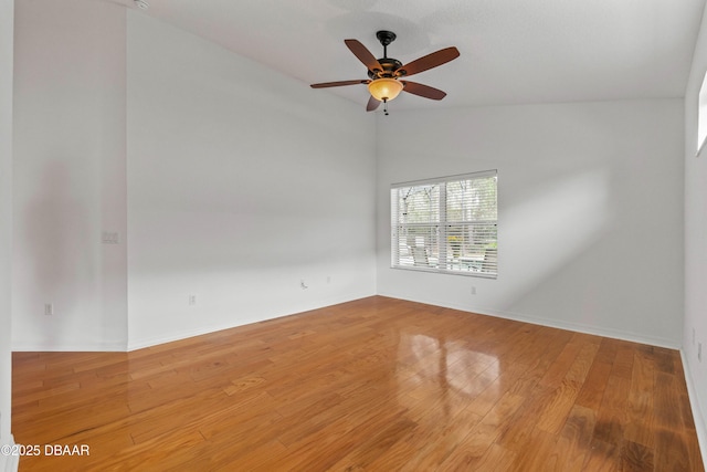 spare room with ceiling fan and hardwood / wood-style floors