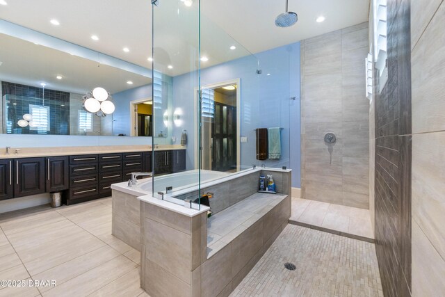 650 Woodbridge Dr, Ormond Beach, FL 32174 - bathroom with tile patterned flooring, a walk in shower, vanity, and recessed lighting