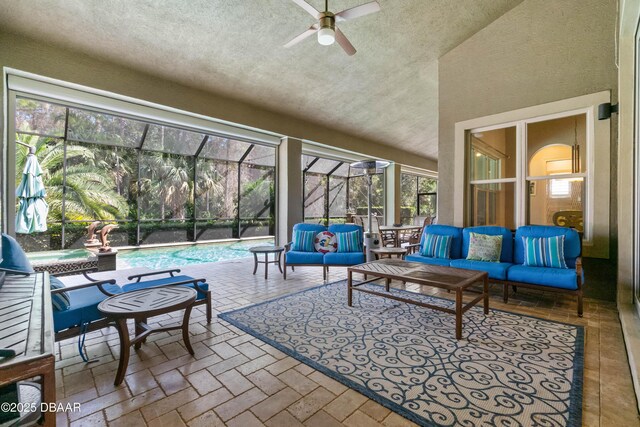 650 Woodbridge Dr, Ormond Beach, FL 32174 - sunroom with an outdoor living space, ceiling fan, a textured ceiling, and high vaulted ceiling